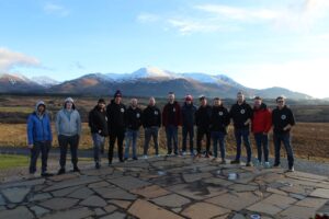 An image of the teams on a previous rally around the North Coast 500, located just outside Fort William with a snow topped mountain near Ben Nevis in the distance - Banger Rally NC500 